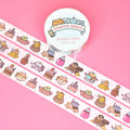 Washi tape with cute cat-themed design on a pink background