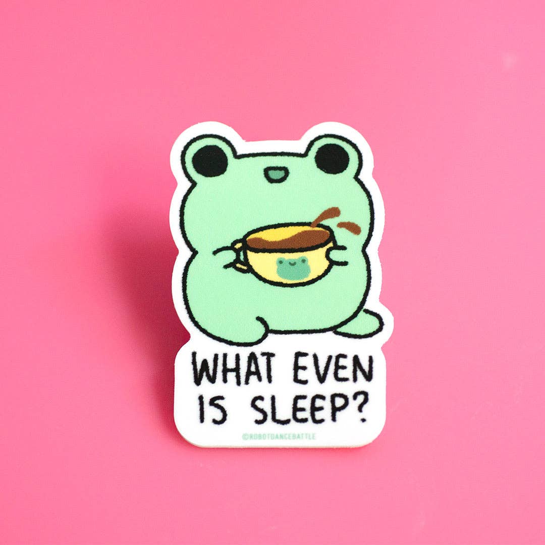 Cartoon frog holding a cup with 'What even is sleep?' text on a pink background