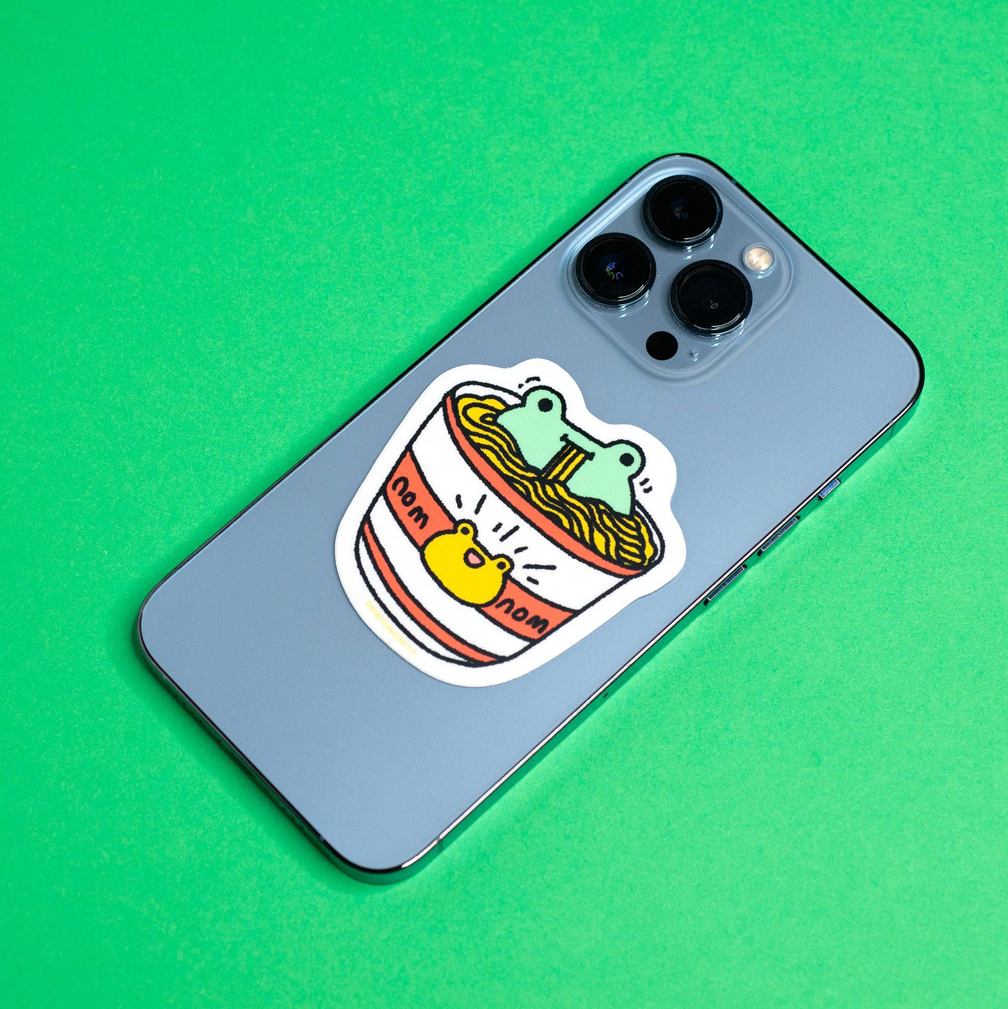 Phone case with a cartoon design on a green background